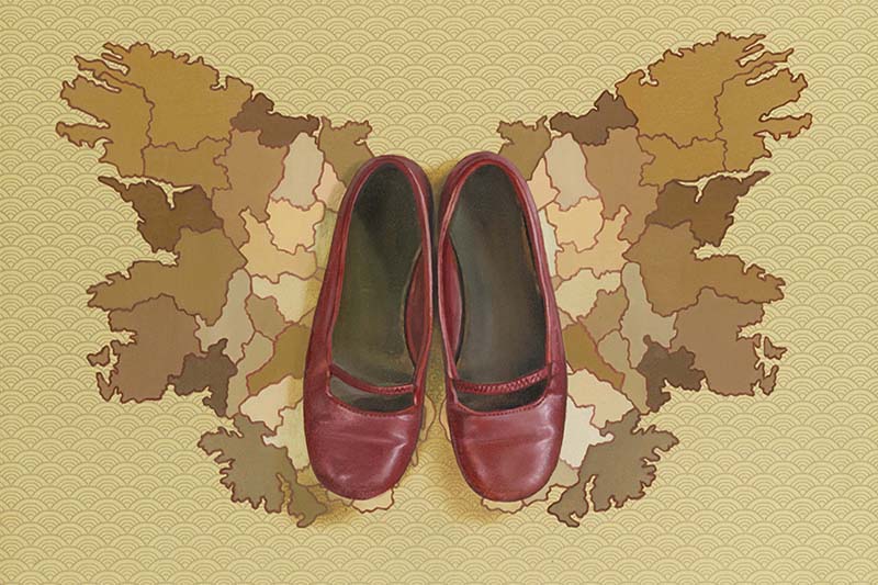 Photo - ONE OF MANY  (red shoes on a map)